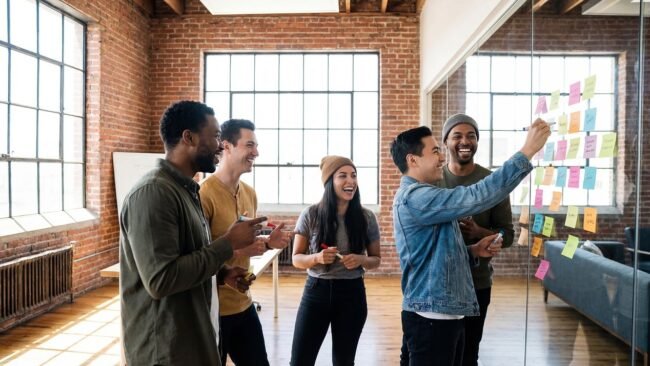 A diverse group of people brainstorming ideas around a table. — ebook sales, "book content strategy"]
