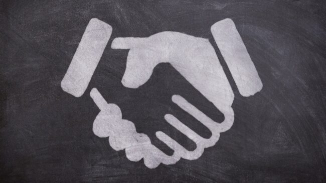 A team gathering feedback on a digital product in a meeting. — cheap PDF strategy, sell digital products