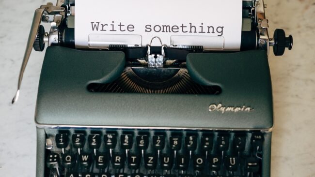 An author actively marketing their book at a local event or online.